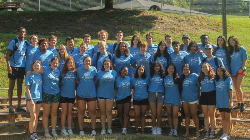 Group photo from the NC Fellows 2022 retreat, featuring members posing in their blue NC Fellows shirts.