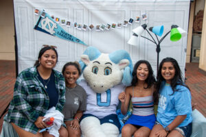 Image of students taking a photo booth photo for theFallfest 2023.