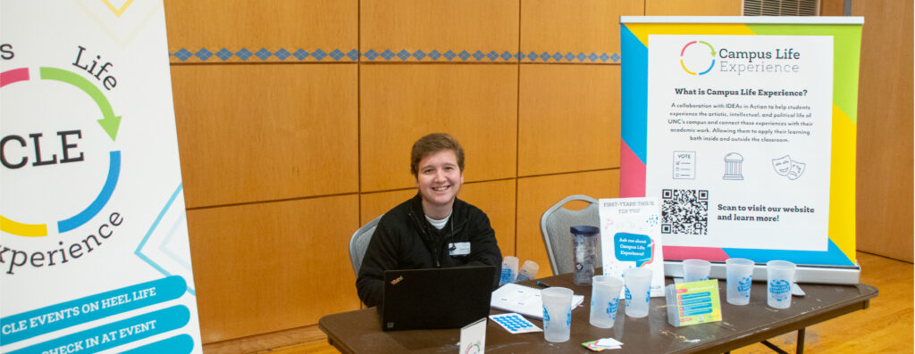 A Campus Life Experiences table with a tabletop banner at an involvement fair event.