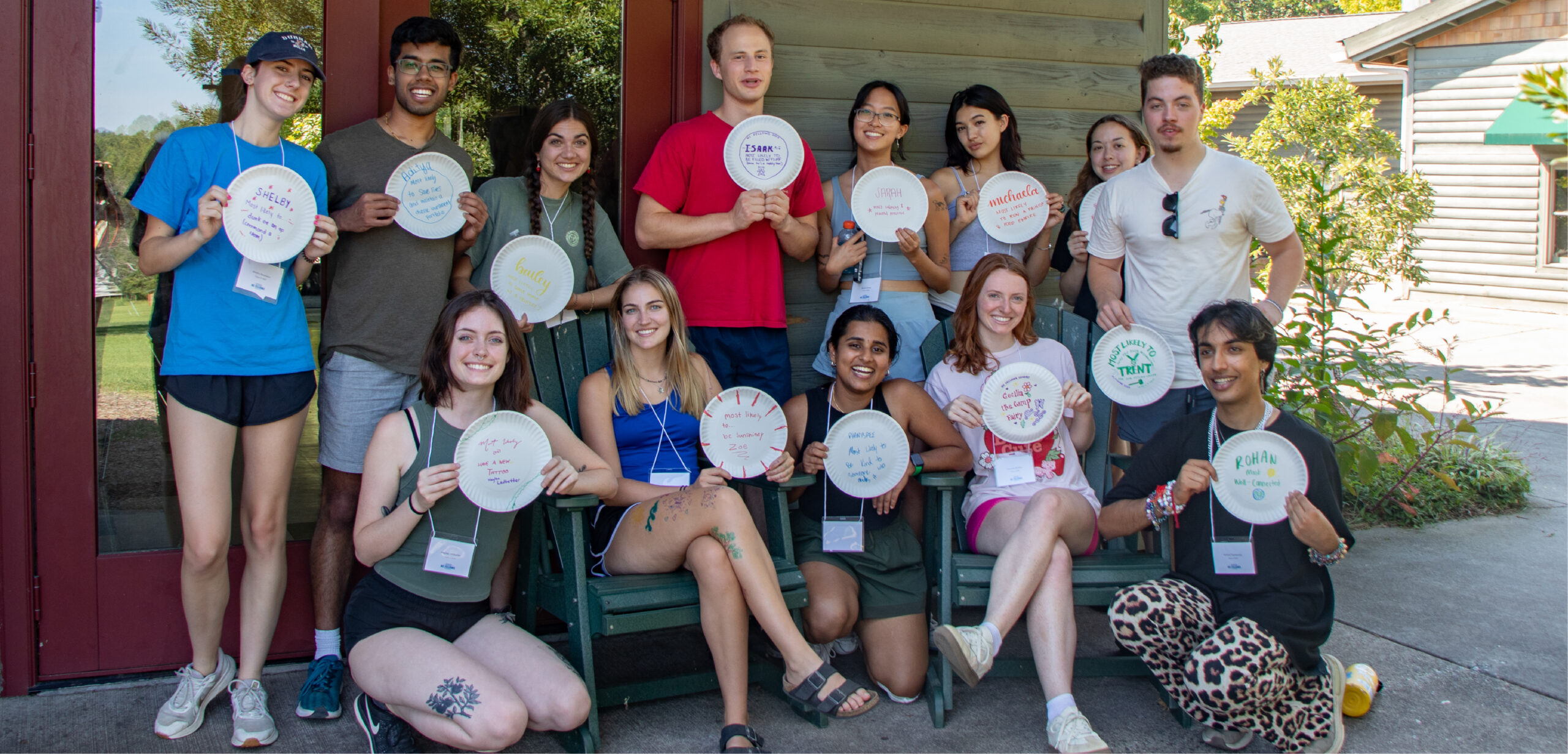 A group of students pose with their handiwork after an activity at the 2024 NC Fellows retreat.