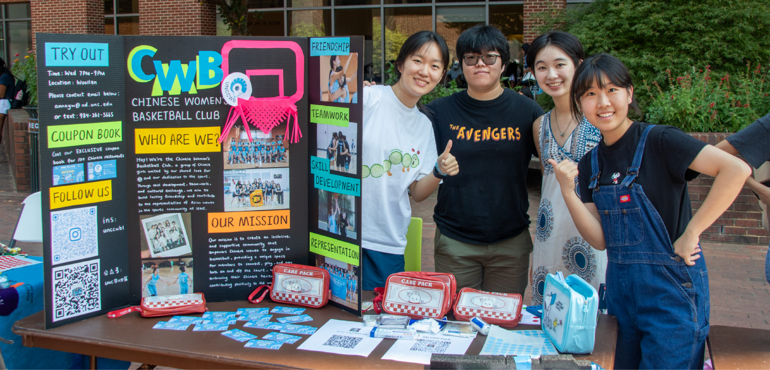 Students from the Chinese Women's Basketball Club pose with their organization's poster at S.O.L.E. Fest.