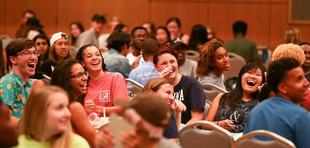 Photo of a group of students in the Carolina Union's Great Hall enjoying an event.