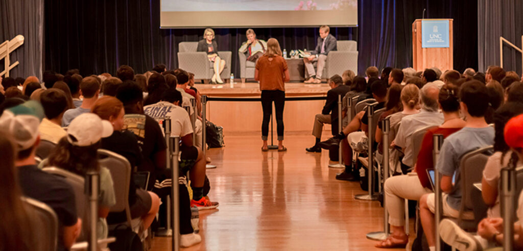 Photo image of UNC student addressing a panel discussion.