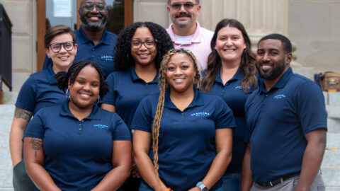 A photo of SLL professional staff members posing at Wilson Library.